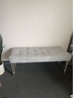 Soft blue bench for bedroom space