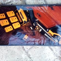 DeWalt Chainsaw Polesaw With Five Batt. One  DeWalt Bluetooth Charger And Tool Bag