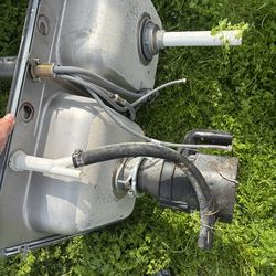 Double  stainless steel sink with faucet and garbage  disposal.