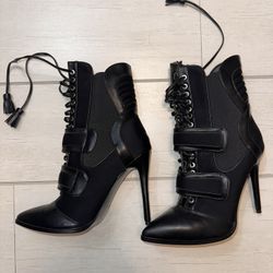 Elegant Black Heeled Boots with Lace-Up Design