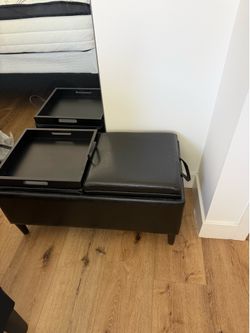 Black storage ottoman