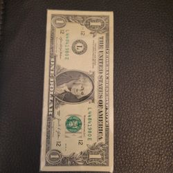 dollar bill with 1980 poker money