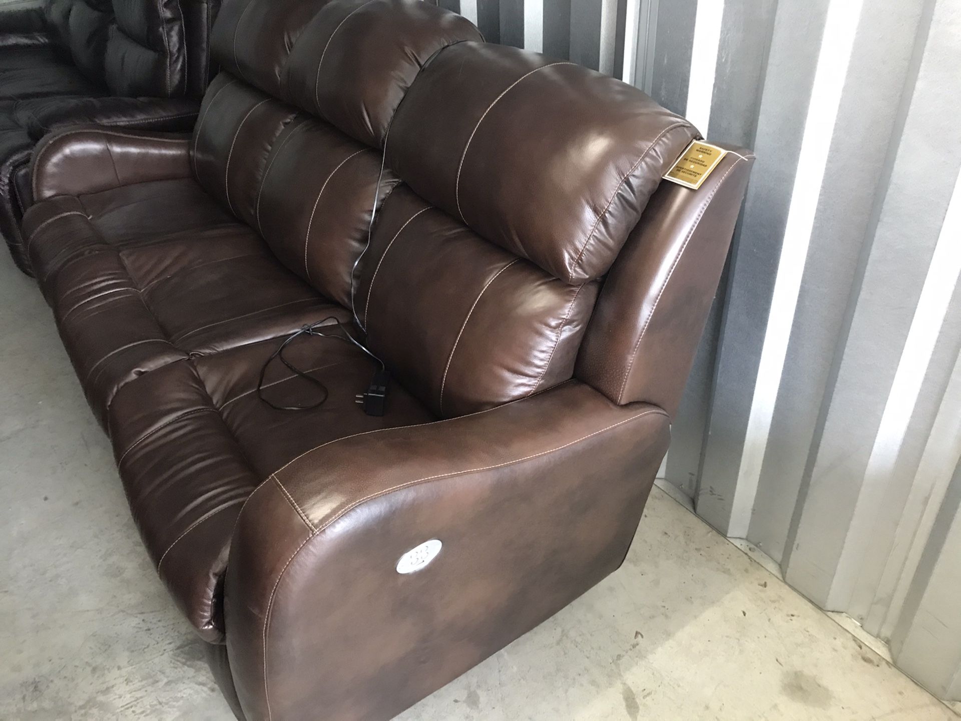 Brand new all power reclining couch.