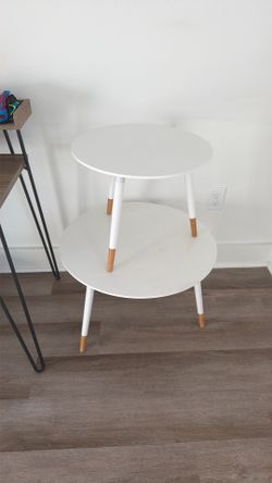 2 white wood tables