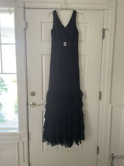 Stunning women’s size 4 long gown. Used once for Pageant. Excellent condition