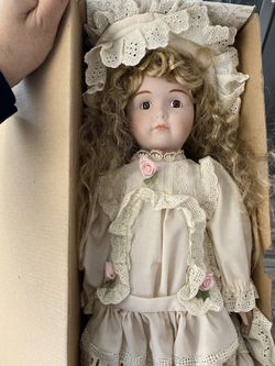 Porcelain doll 16 in