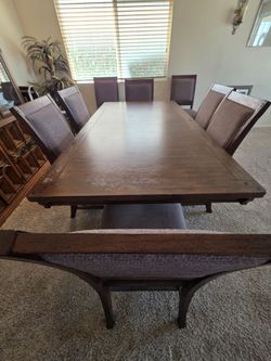 Dining table & 8 sturdy chairs