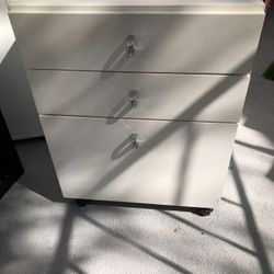 2 Items: White Side Table/Bedside Table With Drawers On Casters, And Tall, Narrow Shelf