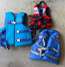 Three Life Vests - Kent, Fluid, Stearns. Price is total for all!