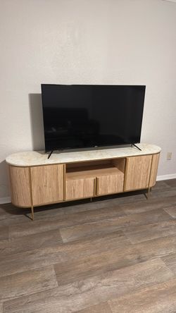 70 inches Tv stand and a 50 onn Roku Tv
