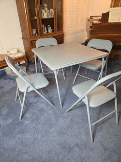 Folding Table & 4 Padded Folding Chairs.