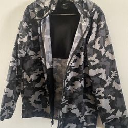 1079. Used Ladies  Nike Camouflage Hooded Windbreaker Jacket Size Small $10