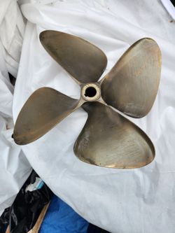 4 Blade brass propeller.