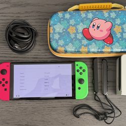 Nintendo Switch OLED with Neon Pink & Green Joy-Cons + Kirby Sparkle Case