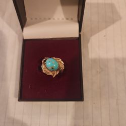 Gold and turquoise ring.