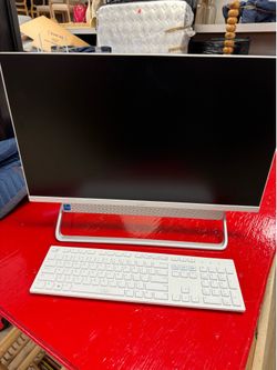 Dell Inspiron 5400 Series All-in-One desktop computer featuring a white finish and a unique silver stand design