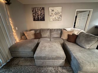 Grey couch with reversible ottoman available for pickup in Hemet ca