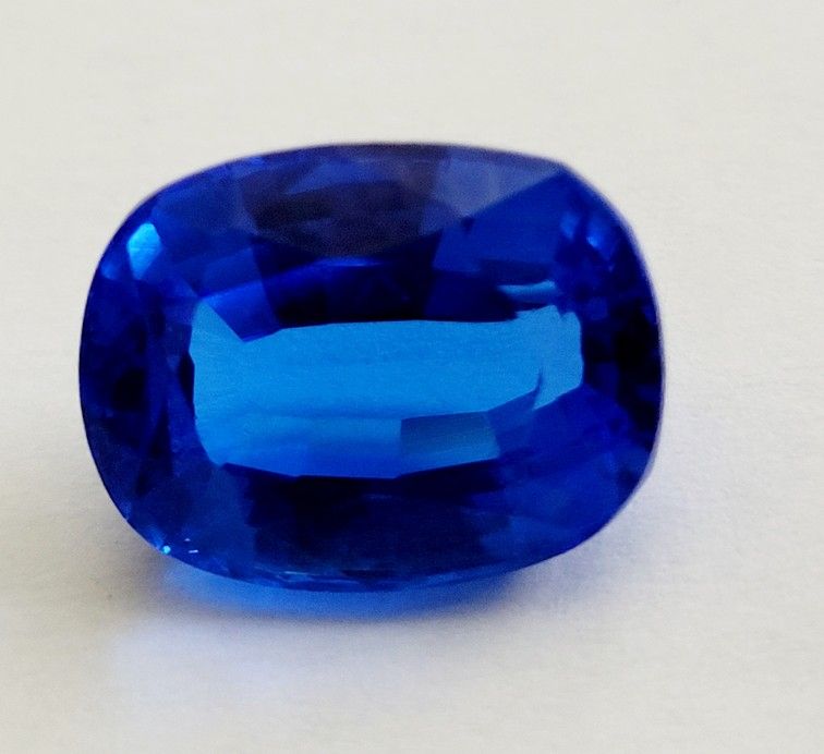 15.10 Ct Loose Clear Blue Zoisite Tanzanite-Like Excellent Cushion Cut Gemstone. 16mm length, 12mm width, 9mm depth. Measurements are approximate. Th