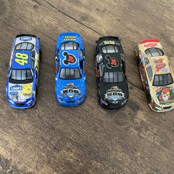 Lot of 4 2 Daytona 500 paint schemes and a jimmy johnson and Santa clause chevy