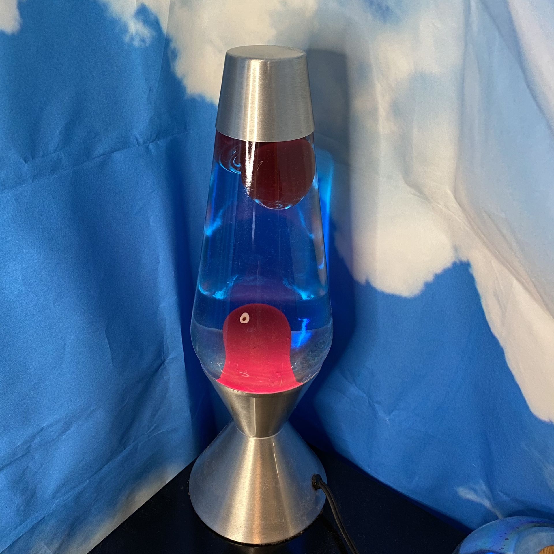 XL Red lava lamp with blue liquid and silver casing