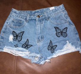 High-Waist Distressed Denim Shorts with Butterfly Print