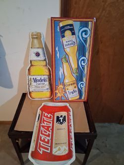 3 metal beer signs