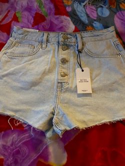 Forever 21 Retro High Rise shorts feature a light wash denim and a button fly Size 27