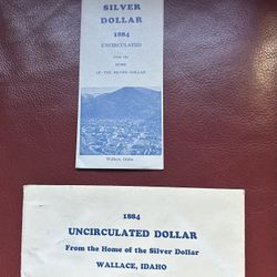 1884-O Morgan Silver Dollar graded as Brilliant Uncirculated with an information pamphlet and envelope titled: “A Silver Dollar 1884 Uncirculated from