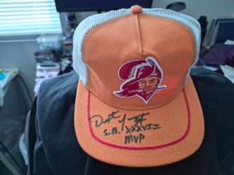 Tampa Bay Buccaneers New Era orange and white trucker-style snapback hat.