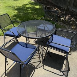 Folding Metal 32” patio Table With 4 stackable Chairs & cushions