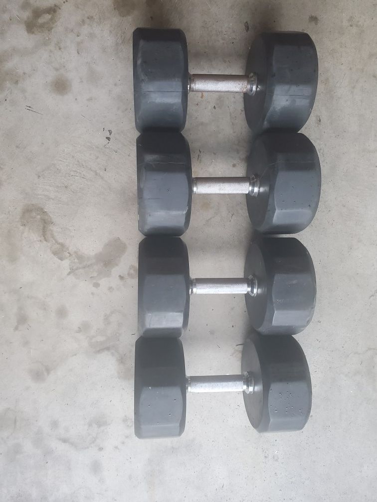 70 and 65 pound dumbbells