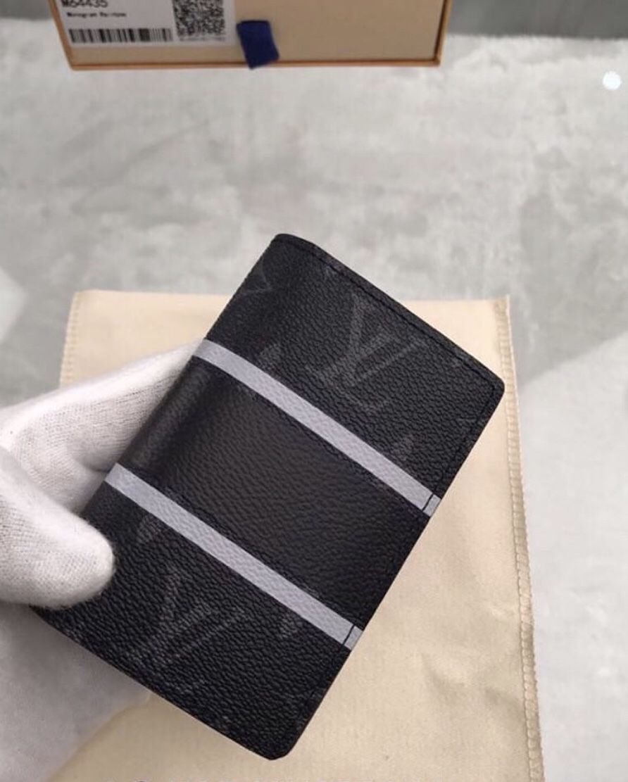 louis-vuitton pocket organizer black with blue lining. Practically unused.