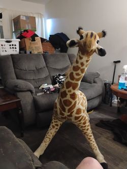 Oversized Jeffery the giraffe stuffed animal