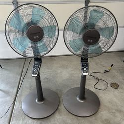 Tall, Blue And Gray Oscillating Fans. Both Work Well And Both Come With Remotes