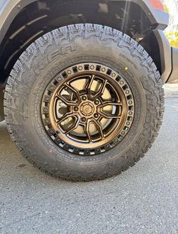 Arena Hustle Smoked Bronze Satin Black Lip Wheels 285|70R17 Falken Wildpeak AT4W Tires Package Deal