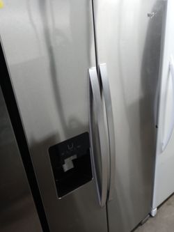 Whirlpool stainless steel side by side refrigerator (no door shelves) - Free delivery