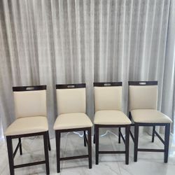 4 ALMOST NEW 1 YR OLD COUNTER STOOLS