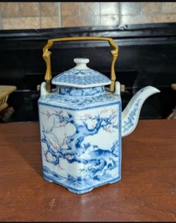 Vintage Dolphin China Dynasty decorative hexagonal porcelain teapot with a brass handle