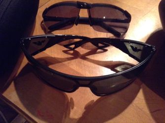 Two pair of men sunglasses with case