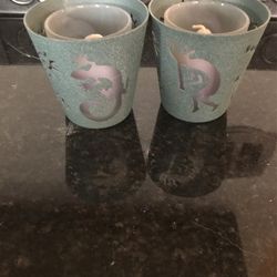 Two Kokopelli Candle Holders Cups.