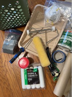 Paint supplies, new paint and rollers, some other used supplies