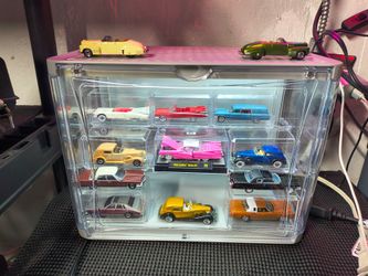 Toy Cadillacs cars in lighted display case