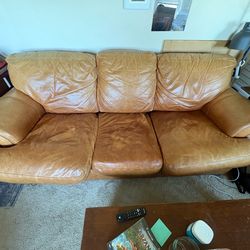 Brown leather couch with matching ottoman
