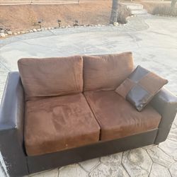 Small Black and Brown Leather Couch 