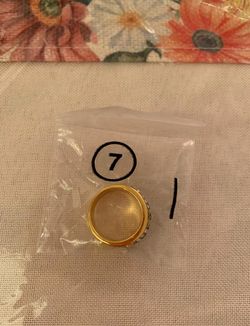 Elegant Gold-Tone Band Ring with Clear and Blue Gemstone Accents