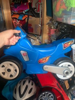 Little tykes ride on blue motorcycle