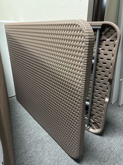 Textured plastic folding table