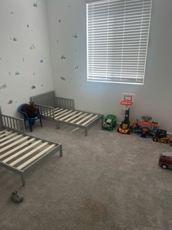 A bunch of boys bedroom stuff and beds