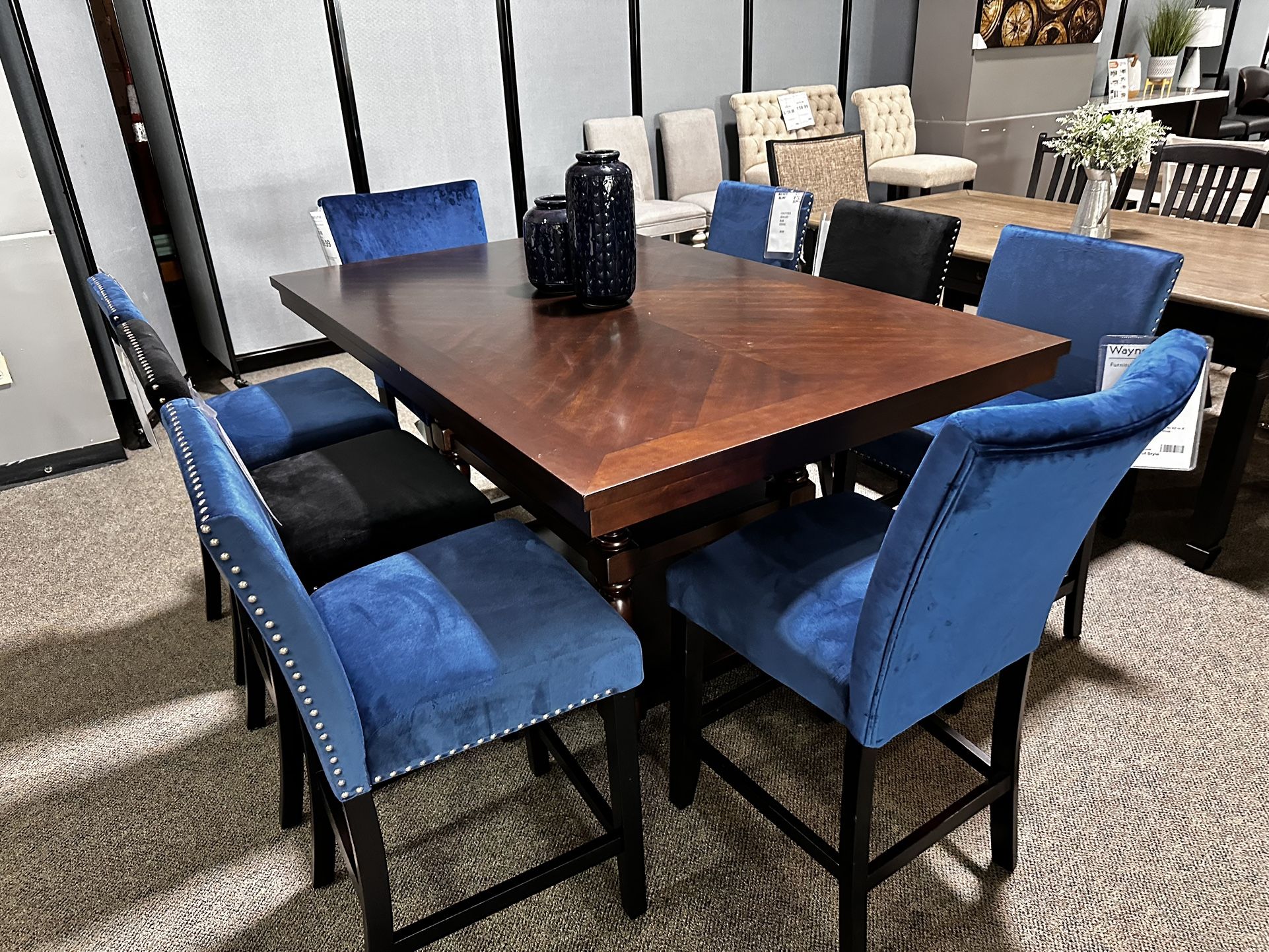 Only $999! Brand New 9 Piece Counter height Dining Set. One table and eight chairs for $999