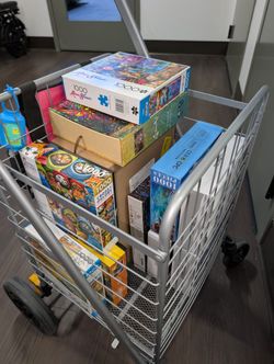 Box of ten 1000 piece puzzles